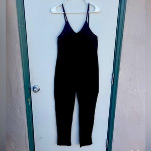 Black cotton/polyester romper jumper.